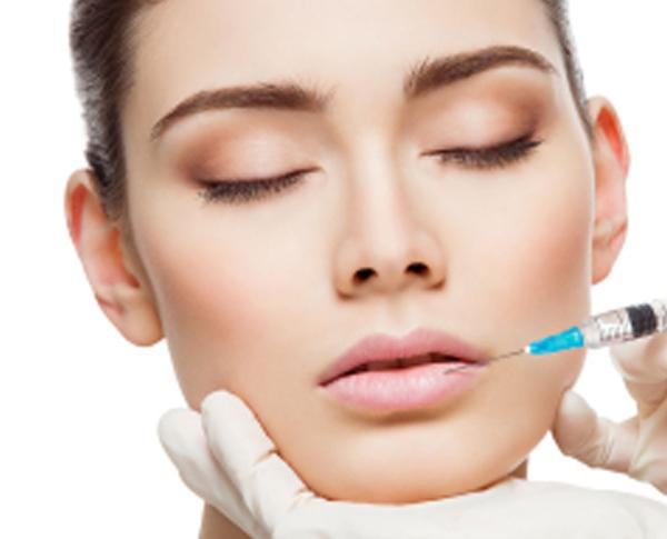 a woman getting filler injections in Beverly Hills